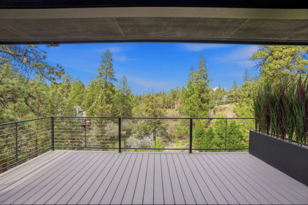 Elevated outdoor deck overlooking ponderosa pines and the natural Central Oregon setting
